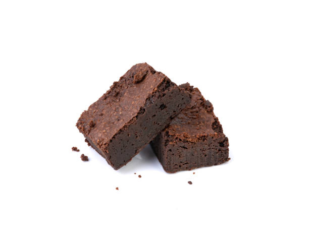 istock Two pieces of brownies isolated over white background 1467917248