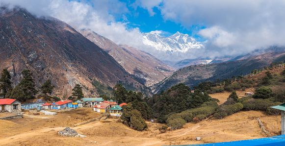 Mt. Everest (8848m), Nuptse (7861m) and Lhotse (8516m) overlooking the teahouses of Tengboche high in the Khumbu Himalayan mountain wilderness of the Sagarmatha National Park, Nepal.