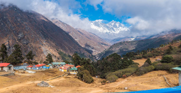 Everest Lhotse overlooking Tengboche teahouses Khumbu valley panorama Himalayas Nepal stock photo