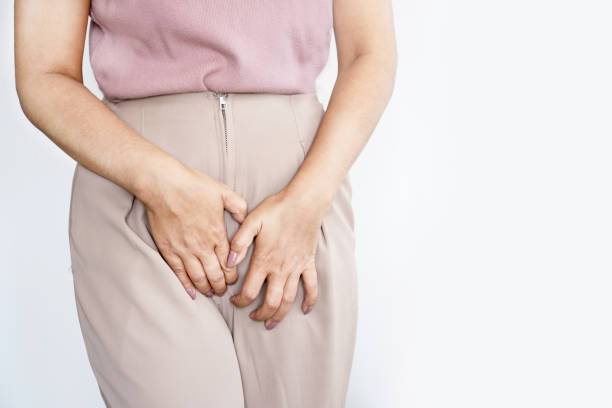 Women suffering from itching and irritation in the vagina and vulva stock photo