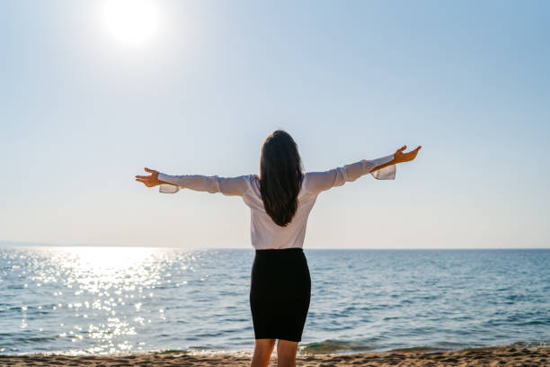 istock Young Woman Feeling Relieved On The Beach 1467918414