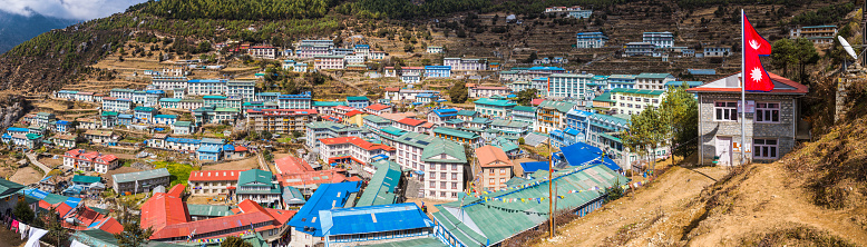 Panoramic view over the rooftop of the teahouses homes of Namche Bazaar, the Sherpa village and trading post high in the Himalayan mountains of Nepal.