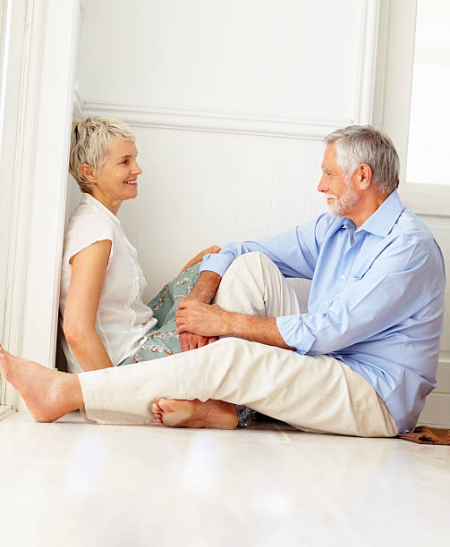 istock Happy senior couple sitting together and discussing 146791890