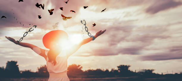 Freedom, Chain - Object, Breaking, Free of Charge, Bird, Change, Concepts, Recovery, New Life, Wellbeing The woman is breaking the chains and setting the birds free, enjoying the nature at sunrise. concept of freedom releasing stock pictures, royalty-free photos & images