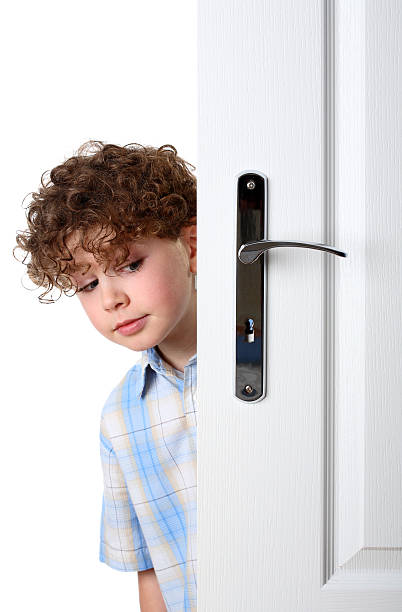 istock Boy peeking behind the door 146792123