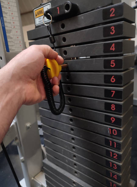 istock Weight plate on a gym machine, with a perspective effect. 1467921768