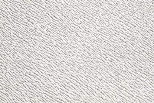 The texture of white paper wallpaper with small volumetric strokes.