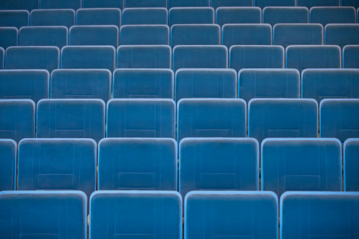 rows of empty seats in the auditorium