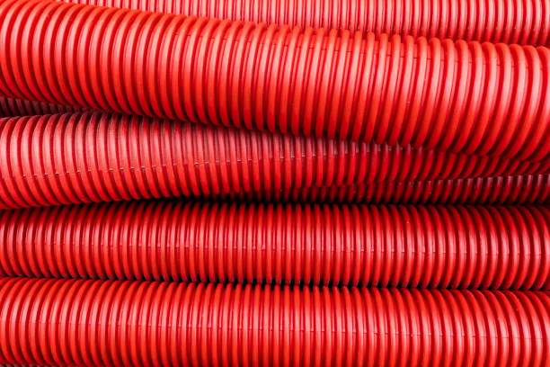 corrugated red plastic ducts - industrislang bildbanksfoton och bilder