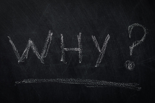 Why ? The word why written in chalk on a blackboard - one of the essential questions in journalism and communication