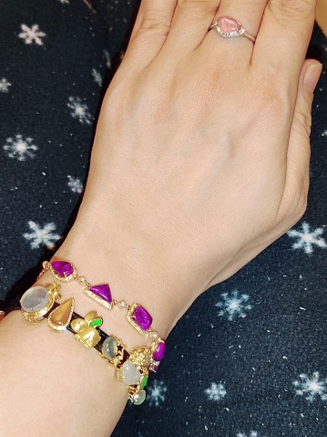 Sugilite ring and jade bracelet