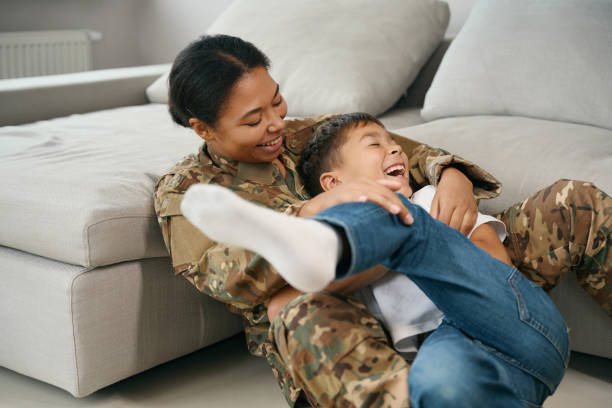 istock Joyful mom and son have fun playing in the room 1467929798