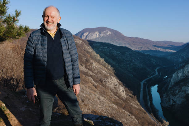 istock Senior man enjoying the scenic landscape 1467930084