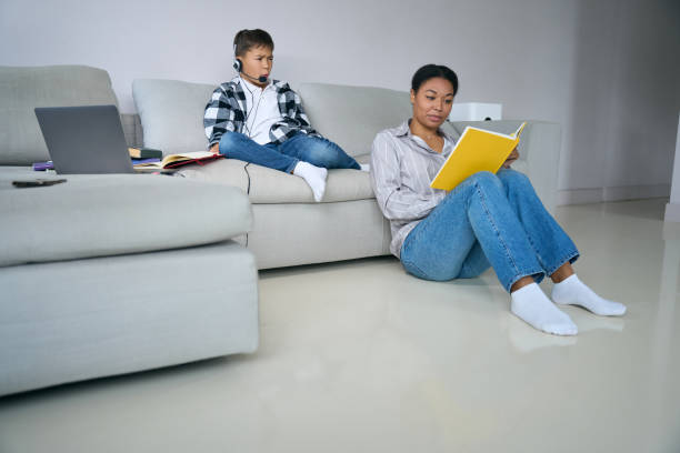 istock Modern teenager on a comfortable home online learning 1467930952