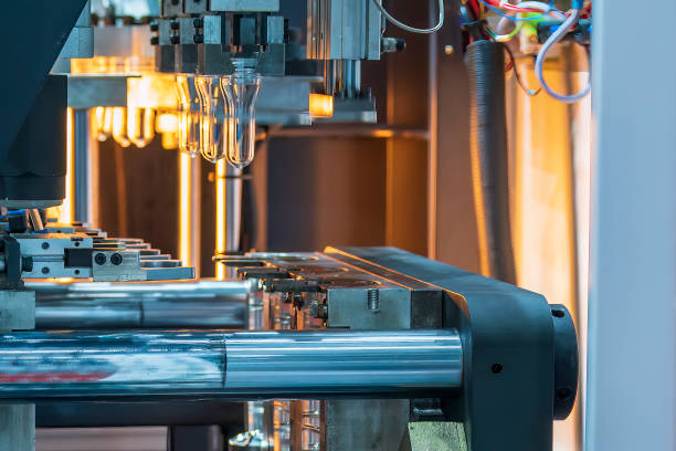 istock The drinking water bottle manufacturing process by blow mold machine. 1467931707