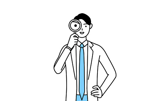 A man doctor in white coats looking through magnifying glasses