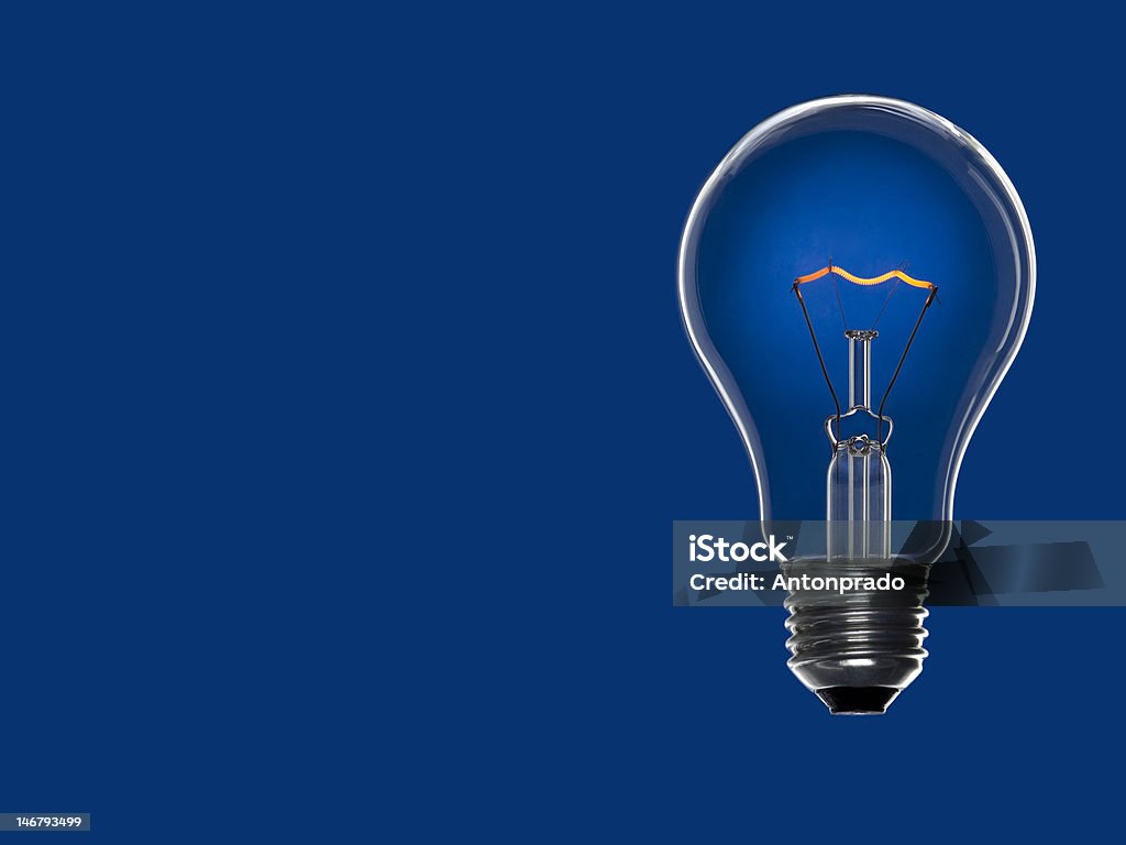 Luz de Bulbo sobre azul - Foto de stock de Azul royalty-free