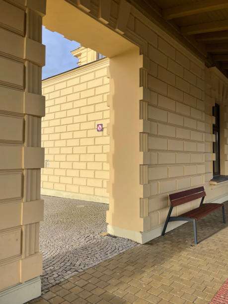 istock Bench near the passageway in the brick wall. 1467936087