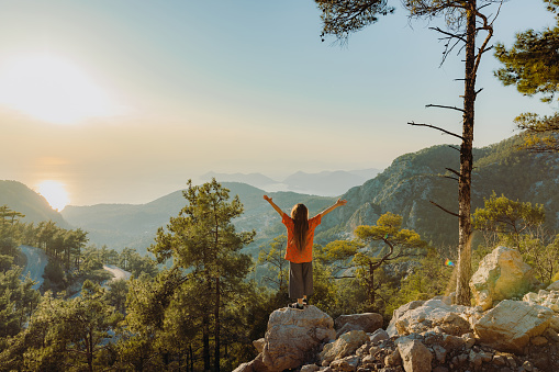 istock Rear view of female contemplating scenic view of Turkey from above during sunset 1467936520
