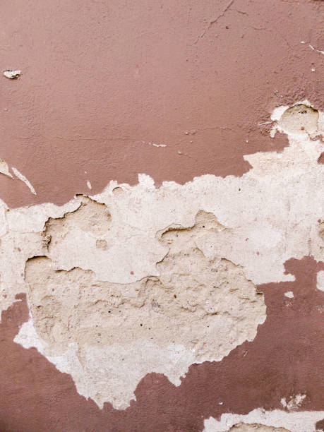 istock Old paint on the wall cracked and crumbled. 1467937234