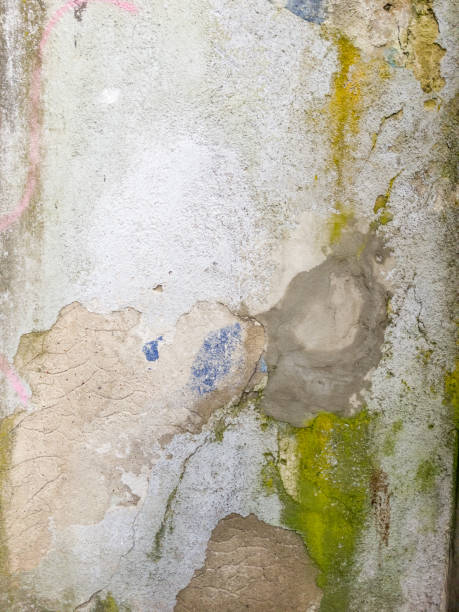 istock Cracked wall with old layers of paint. 1467937373