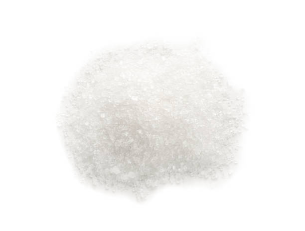 istock Pile of granulated sugar isolated on white, top view 1467937759