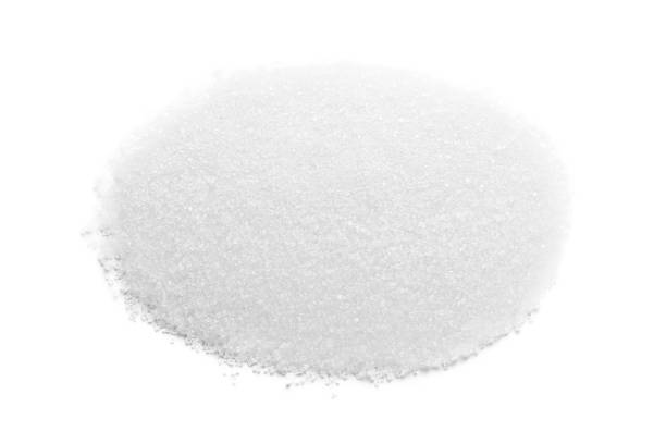 istock Pile of granulated sugar isolated on white 1467937798