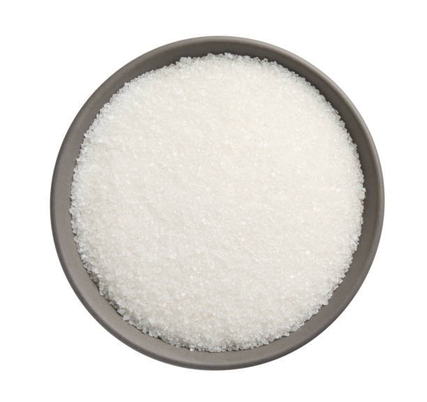 istock Granulated sugar in bowl isolated on white, top view 1467938363