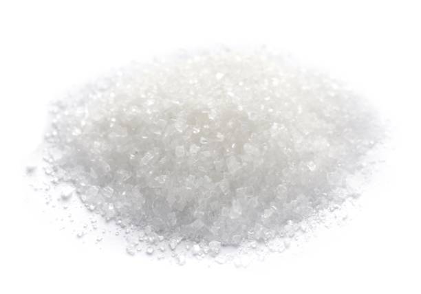 istock Pile of granulated sugar isolated on white 1467938486