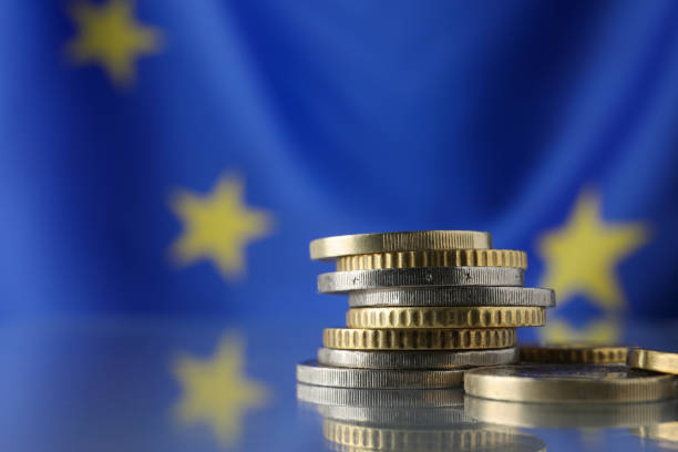 istock Coins on table against European Union flag, closeup. Space for text 1467942288