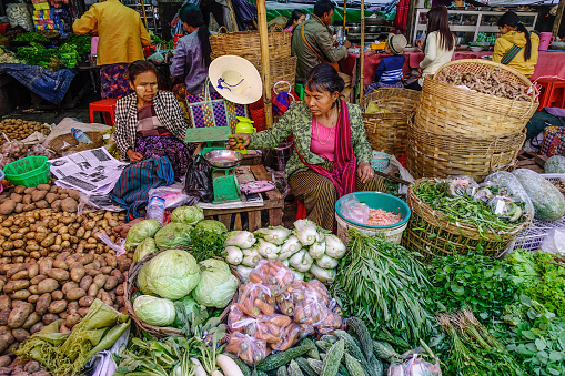 Taunggyi, Myanmar - Feb 8, 2017. Vendor selling vegetable at rural market in Taunggyi, Myanmar. Taunggyi is the biggest city in eastern Myanmar.