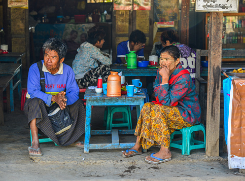 Yangon, Myanmar - Feb 8, 2017. People drink coffee on street in Yangon, Myanmar. Yangon is Myanmar largest city and its most important commercial centre.