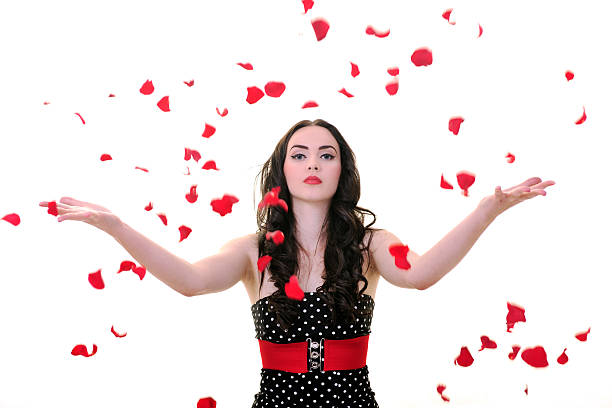istock young woman with falling rose petals 146794618