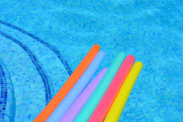 istock Rainbow noodle floats at poolside in summer 1467947893