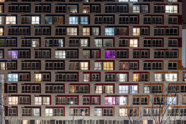 istock Living apartment building windows at night. 1467950145