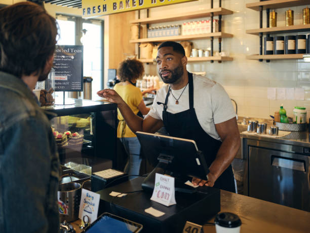 istock Customers and Employees in a Coffee Shop 1467950685