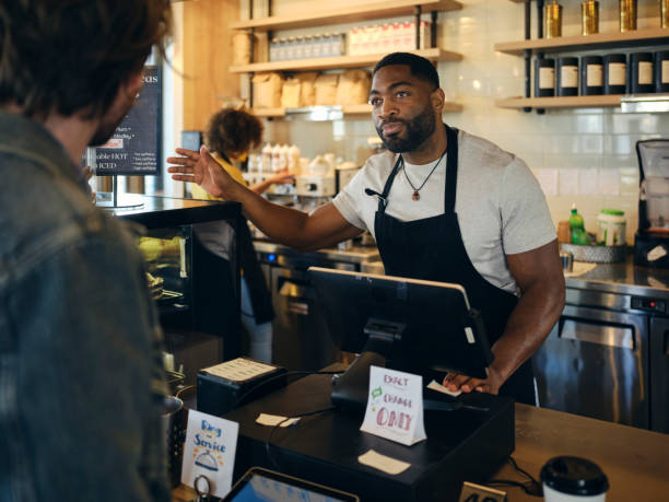 istock Customers and Employees in a Coffee Shop 1467950722