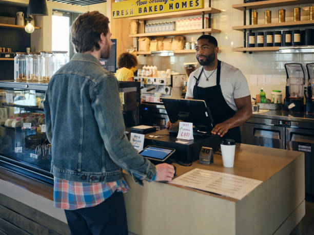 istock Customers and Employees in a Coffee Shop 1467951341