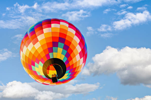 istock Hot air balloon flight over blue sky 1467951409
