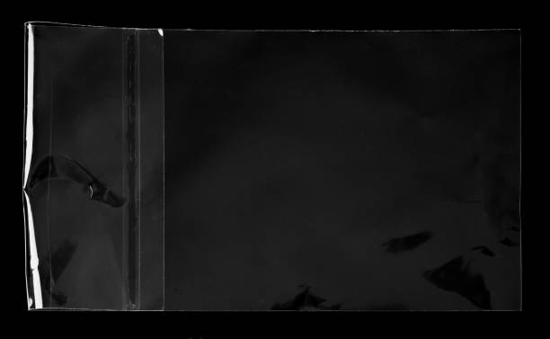 istock Blank transparent plastic bag overlay on black background 1467954333