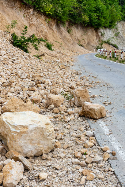 istock Limestone rockfall and landslide fallen and blocking tarmac road leading to Khvamli Mountain peak in Georgia. 1467955551