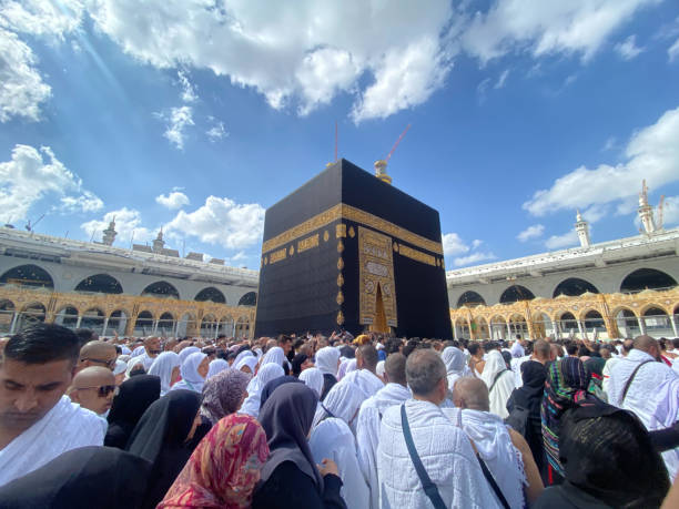 Muslim Pilgrims at The Kaaba in The Haram Mosque of Mecca , Saudi Arabia, In the morning performing umrah Muslim Pilgrims at The Kaaba in The Haram Mosque of Mecca , Saudi Arabia, In the morning performing umrah kaabah stock pictures, royalty-free photos & images