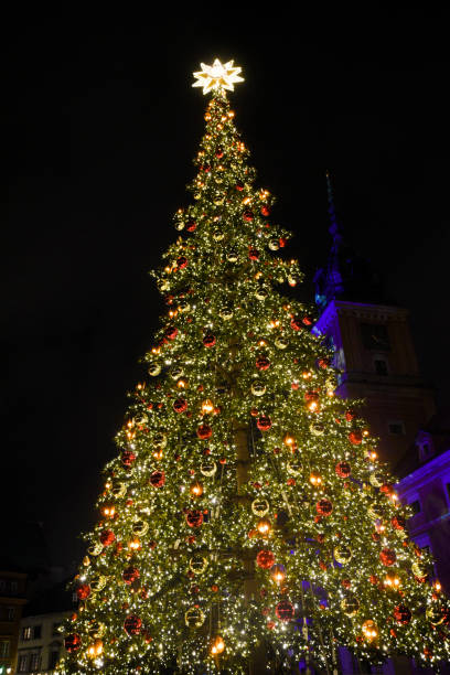 istock Christmas tree in the square decorated with bubbles and lights. 1467962215