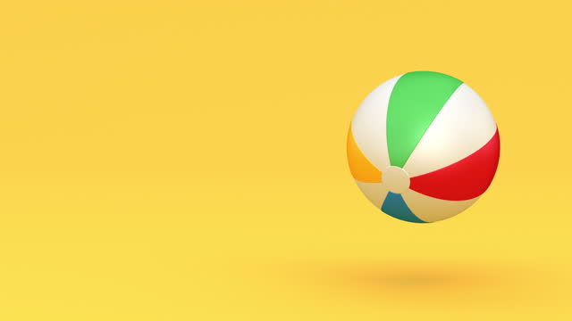 Perfectly seamless loop. Colorful inflatable beach ball bouncing  on the yellow background. Summer vacations theme.