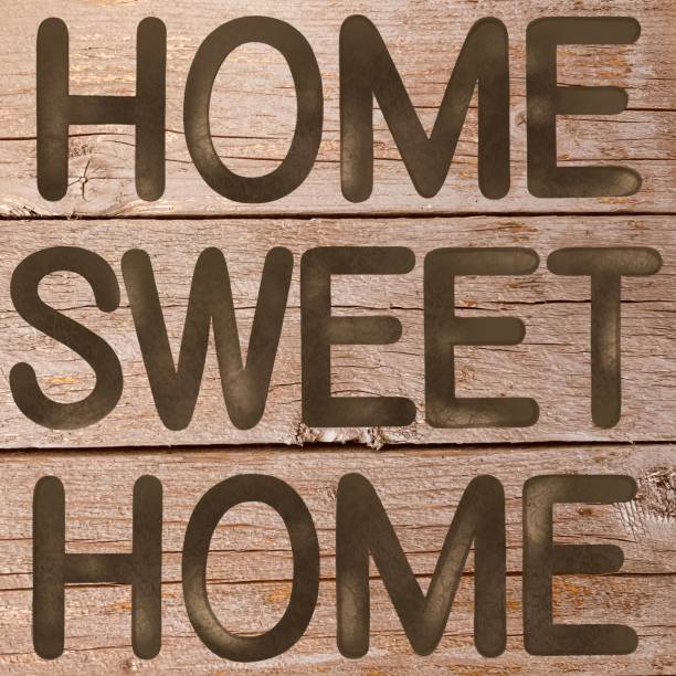 istock Rustic home sweet home sign with a wooden plank background 1467962372