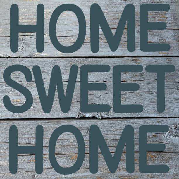 istock Rustic home sweet home sign with a grey wooden plank background 1467962379