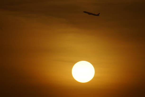 istock Beautiful Sunrise and aircraft rising 1467963818