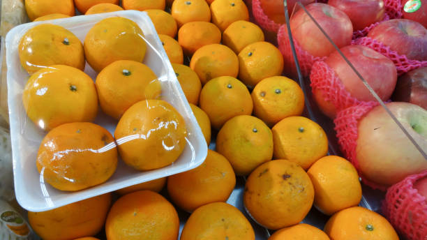 istock Fresh fruit displayed on the market: oranges and apples 1467963928