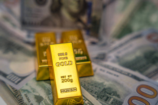 gold bar on 100 dollar bills. investment