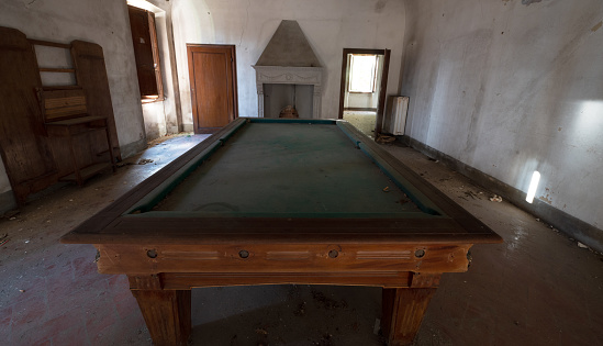 Vintage pool table in ancient villa.